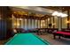 A game room with billiards and card tables perfect for entertaining and relaxing with friends at 20169 Cristoforo Pl, Venice, FL 34293