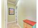 Hallway with tile floors and colorful decorations at 20169 Cristoforo Pl, Venice, FL 34293