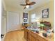 This home office is equipped with a wooden desk, a comfortable chair, and ample storage for all your work needs at 20169 Cristoforo Pl, Venice, FL 34293