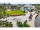 Community green space with entertainment and water feature at 20443 Cristoforo Pl, Venice, FL 34293