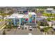 A parking lot and the side of a commercial building with an enormous mural on it at 20443 Cristoforo Pl, Venice, FL 34293