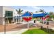 Colorful shade structures and seating create a welcoming community space for relaxation and social gatherings at 20443 Cristoforo Pl, Venice, FL 34293