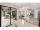 Open dining area featuring a modern chandelier and direct access to the patio at 20443 Cristoforo Pl, Venice, FL 34293