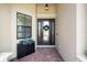 Inviting entryway featuring a glass door, sidelight windows, and neutral paint at 20443 Cristoforo Pl, Venice, FL 34293