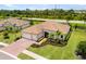Stunning home with a tile roof, well-manicured lawn, and a three car garage at 20443 Cristoforo Pl, Venice, FL 34293
