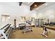 Well-equipped gym featuring weights, mirrors, and multiple workout stations for residents to enjoy at 20443 Cristoforo Pl, Venice, FL 34293