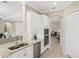 This kitchen features granite counters, stainless appliances, and white cabinets at 20443 Cristoforo Pl, Venice, FL 34293