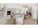 Bright kitchen with granite countertops, stainless appliances and neutral decor opens to living area at 20443 Cristoforo Pl, Venice, FL 34293