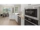 The kitchen features stainless appliances, granite counters and a large sink at 20443 Cristoforo Pl, Venice, FL 34293