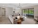 Open living area with modern decor, glass sliding doors, and tile floors at 20443 Cristoforo Pl, Venice, FL 34293