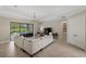Cozy living room featuring tile floors, a comfortable sofa, and backyard views at 20443 Cristoforo Pl, Venice, FL 34293