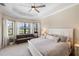 Spacious main bedroom boasts bay window sitting area and tray ceiling at 20443 Cristoforo Pl, Venice, FL 34293