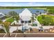 A community lawn and outdoor gathering area with playhouses at 20443 Cristoforo Pl, Venice, FL 34293