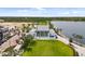 A community lawn and outdoor gathering area near a lake at 20443 Cristoforo Pl, Venice, FL 34293