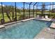 Screened-in pool offers a relaxing escape with poolside seating at 20443 Cristoforo Pl, Venice, FL 34293
