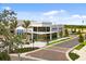 A restaurant exterior with large windows, ample parking, and sidewalk at 20443 Cristoforo Pl, Venice, FL 34293