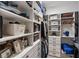 Spacious walk-in closet with custom shelving for organized storage at 20443 Cristoforo Pl, Venice, FL 34293