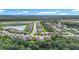 Beautiful aerial view of the neighborhood with lake views and lush landscaping at 20749 Swallowtail Ct, Venice, FL 34293
