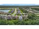 View of this neighborhood that showcases the backyards, screened-in pools, landscaping, and surrounding foliage at 20749 Swallowtail Ct, Venice, FL 34293