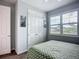 Comfortable bedroom with large closet, plantation shutters and a ceiling fan at 20749 Swallowtail Ct, Venice, FL 34293