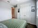 Cozy bedroom with a ceiling fan, large closet, and a decorative bedspread at 20749 Swallowtail Ct, Venice, FL 34293