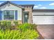 Charming one-story home with brick-paved driveway and well-maintained landscaping at 20749 Swallowtail Ct, Venice, FL 34293