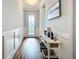Hallway with a decorative table and a glass door entrance at 20749 Swallowtail Ct, Venice, FL 34293