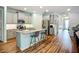 Modern kitchen with stainless steel appliances, gray cabinets, and granite countertops at 20749 Swallowtail Ct, Venice, FL 34293