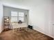 Bright office space with carpet, white desk, and natural light from the window at 20749 Swallowtail Ct, Venice, FL 34293