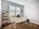Bright office space with carpet, white desk, and natural light from the window at 20749 Swallowtail Ct, Venice, FL 34293