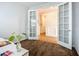 Office space with french doors, hardwood floors in the hallway and neutral decor at 20749 Swallowtail Ct, Venice, FL 34293