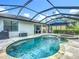 Beautiful pool and spa area with a screened-in enclosure, perfect for enjoying the outdoors while relaxing in your backyard at 20749 Swallowtail Ct, Venice, FL 34293
