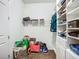 This closet contains well-organized shelving for bags, shoes, clothes and other items at 20749 Swallowtail Ct, Venice, FL 34293