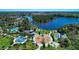 Aerial view of community featuring a playground, water park, picnic area, pool and surrounding lakes at 21641 Winter Park Ct, Venice, FL 34293
