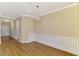 Dining room with wooden floors, chair rail, and a modern chandelier at 21641 Winter Park Ct, Venice, FL 34293