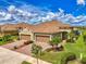 Beautiful home with well-maintained landscaping, paver driveway, and a two-car garage at 21641 Winter Park Ct, Venice, FL 34293