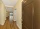 Elegant foyer featuring wood floors, high ceilings, and an open view to the living area at 21641 Winter Park Ct, Venice, FL 34293