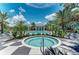 Community hot tub with black and white checkerboard tile and palm trees at 21641 Winter Park Ct, Venice, FL 34293