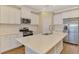 Well-lit kitchen featuring granite countertops, stainless steel appliances, and a kitchen island at 21641 Winter Park Ct, Venice, FL 34293