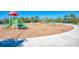 Community playground featuring colorful slides and climbing structures surrounded by a bark-covered play area at 21641 Winter Park Ct, Venice, FL 34293