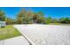 A sand volleyball court surrounded by lush landscaping at 21641 Winter Park Ct, Venice, FL 34293