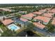 Aerial view of the community featuring well-maintained landscaping and a pond with a fountain at 2204 L Pavia Blvd # 2204, Venice, FL 34292