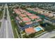 Stunning aerial view of community featuring lush greenery and picturesque pond at 2204 L Pavia Blvd # 2204, Venice, FL 34292