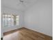 Bright bedroom with wood floors, ceiling fan, and window offering natural light at 2204 L Pavia Blvd # 2204, Venice, FL 34292
