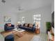 Bright and cozy living room with a modern sofa, chairs, and a decorative coffee table at 2204 L Pavia Blvd # 2204, Venice, FL 34292