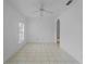 Neutral living room with tile flooring, arched doorways, and ceiling fan at 2204 L Pavia Blvd # 2204, Venice, FL 34292