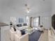 An open-concept living room with ample seating and large windows for natural light at 2204 L Pavia Blvd # 2204, Venice, FL 34292