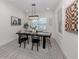 Elegant dining room with modern lighting, stylish decor, and a comfortable seating arrangement at 2245 Pickard Ln, North Port, FL 34286