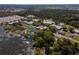Scenic aerial shot of an education campus with large buildings, green spaces, and a lake at 2355 Allsup Ter, North Port, FL 34286