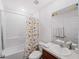 Bright bathroom featuring a shower and tub combo, sink with vanity, toilet, and dinosaur-themed decor at 2355 Allsup Ter, North Port, FL 34286